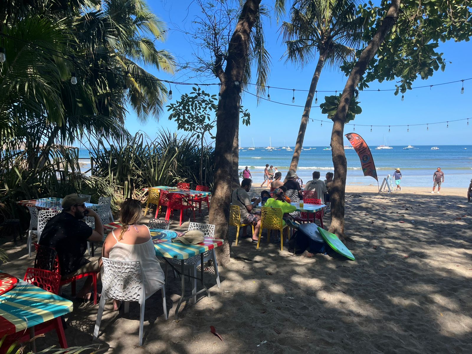Outside tables on the beach at Waffle Monkey Tamarindo